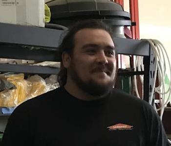 man in black shirt in warehouse 